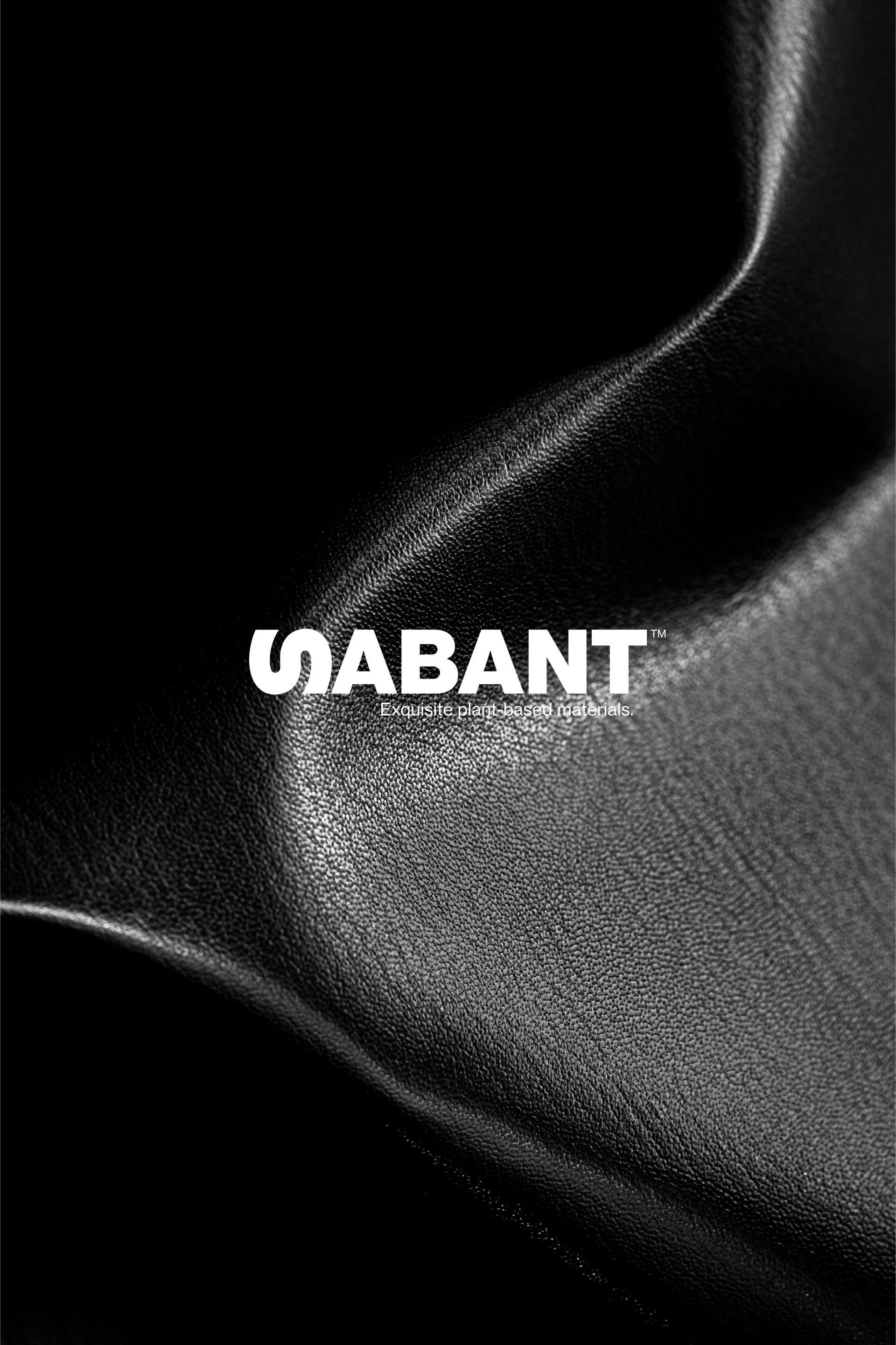 black plant based leather closeup with sabant logo