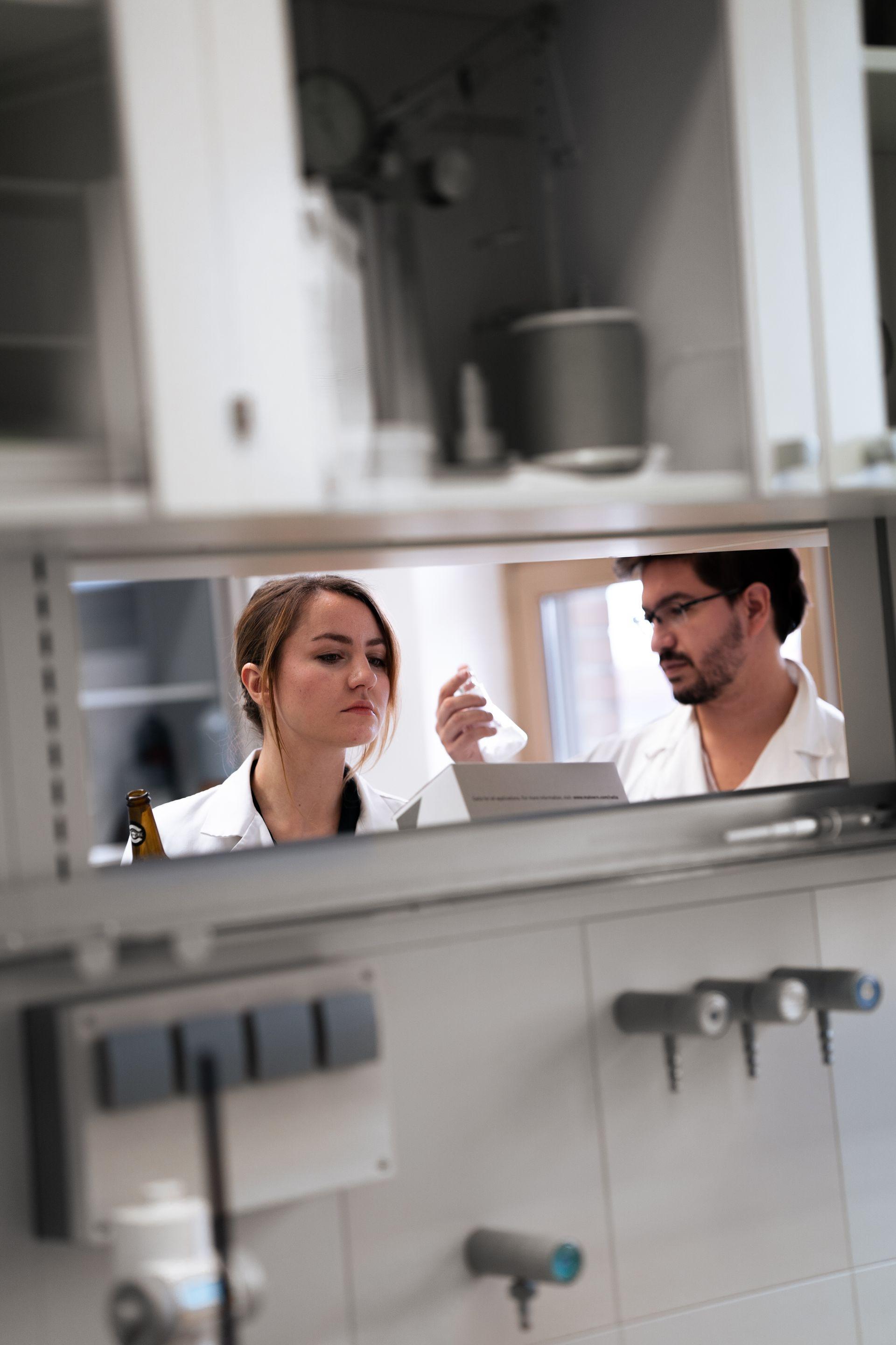 Scientists male and female working in a lab