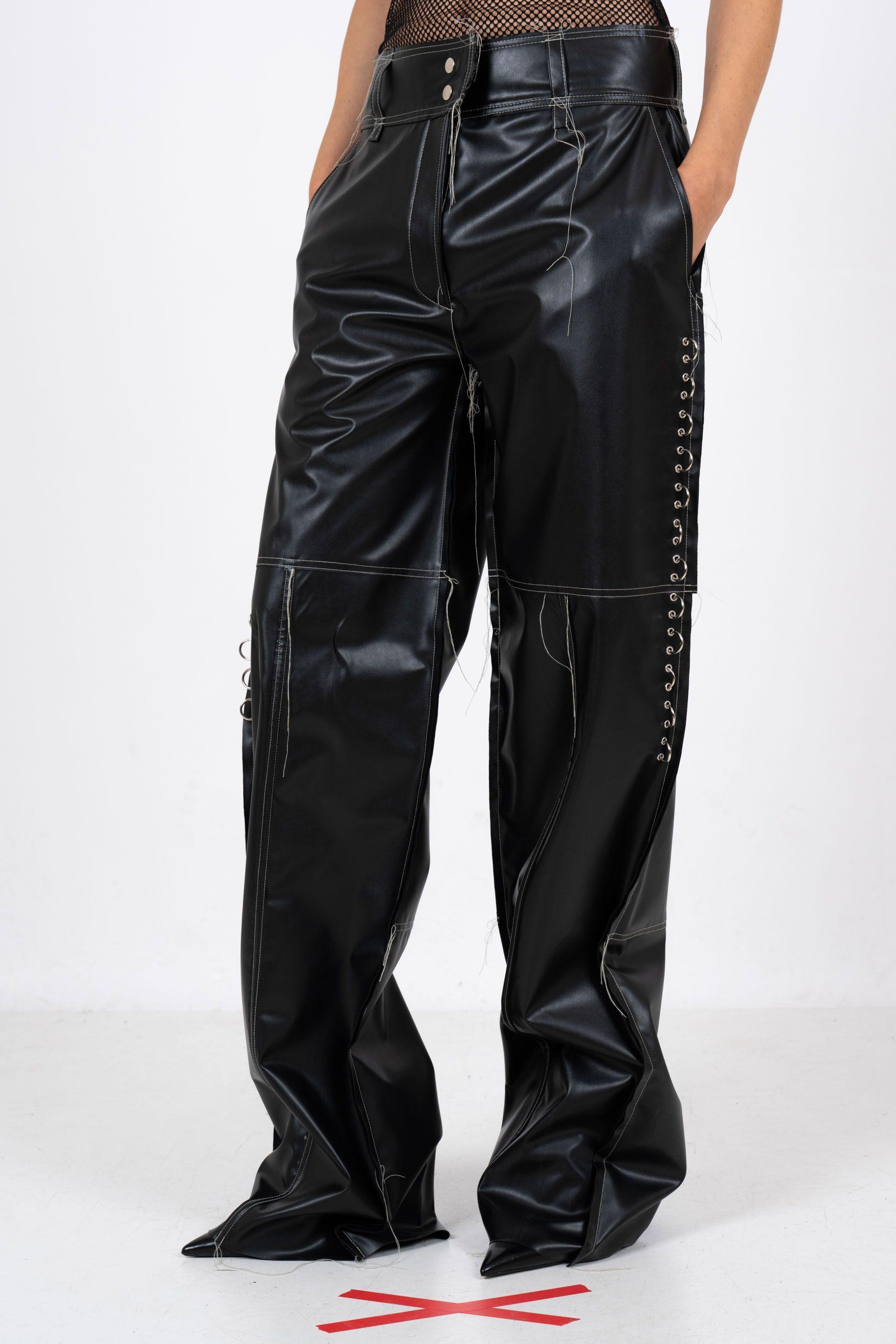 Wide-leg black leather trousers with side perforations, made from sustainable gin production materials.